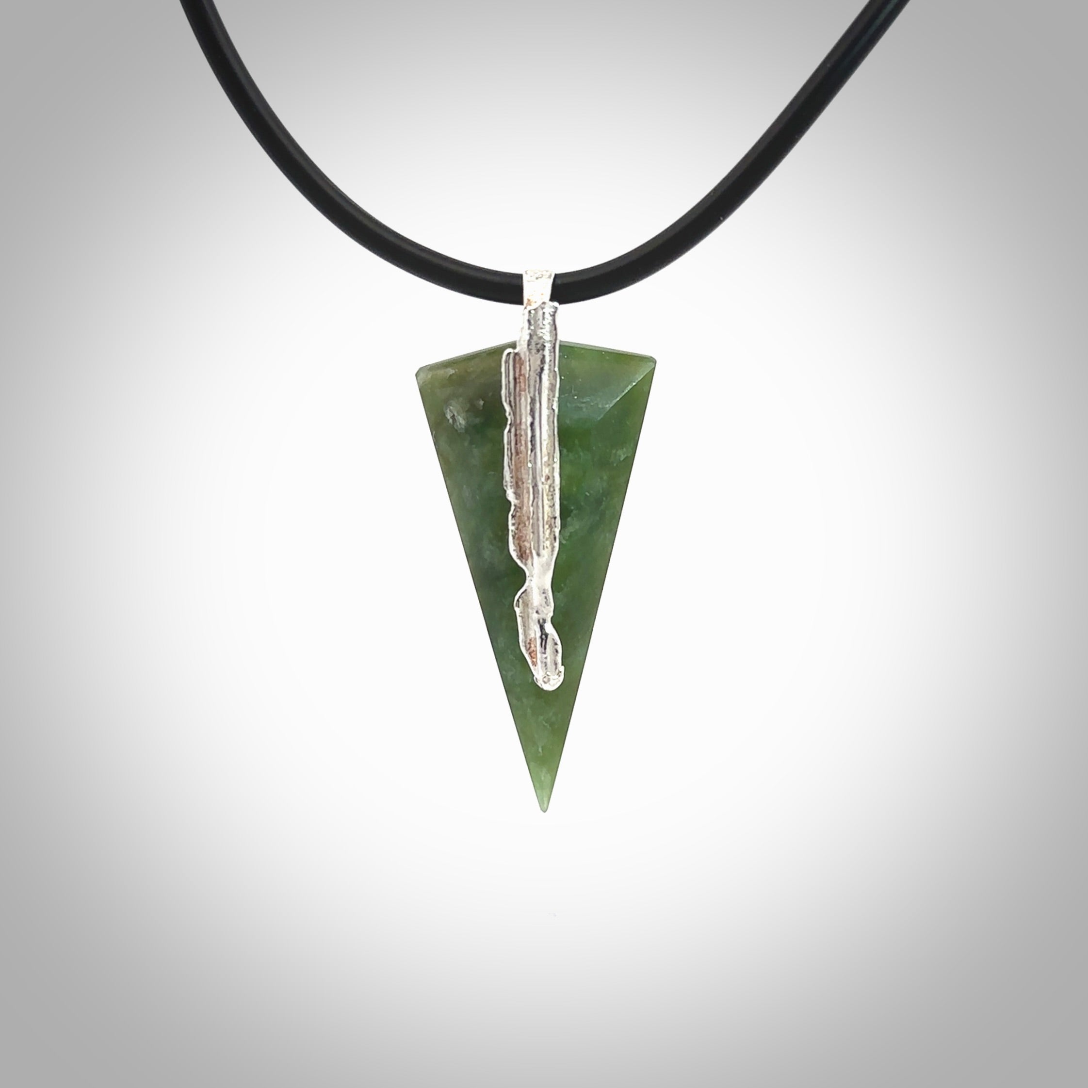 A photo of a New Zealand Jade drop pendant with sterling silver. This is a stylish statement piece - hand crafted here in New Zealand by Ana Krakosky. Unique Art to Wear. Gifts for all lovers of hand made Art to Wear.