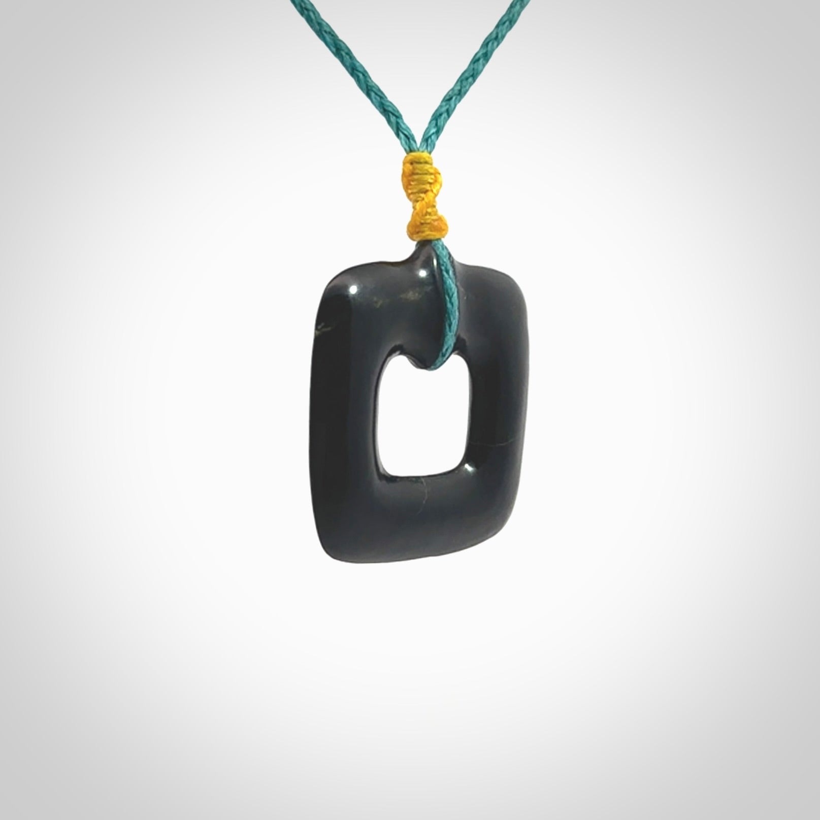 Contemporary pendant hand carved from Australian Black Jade. Designed and made by NZ Pacific. All hand carved in Black Jade and provided with adjustable cords.