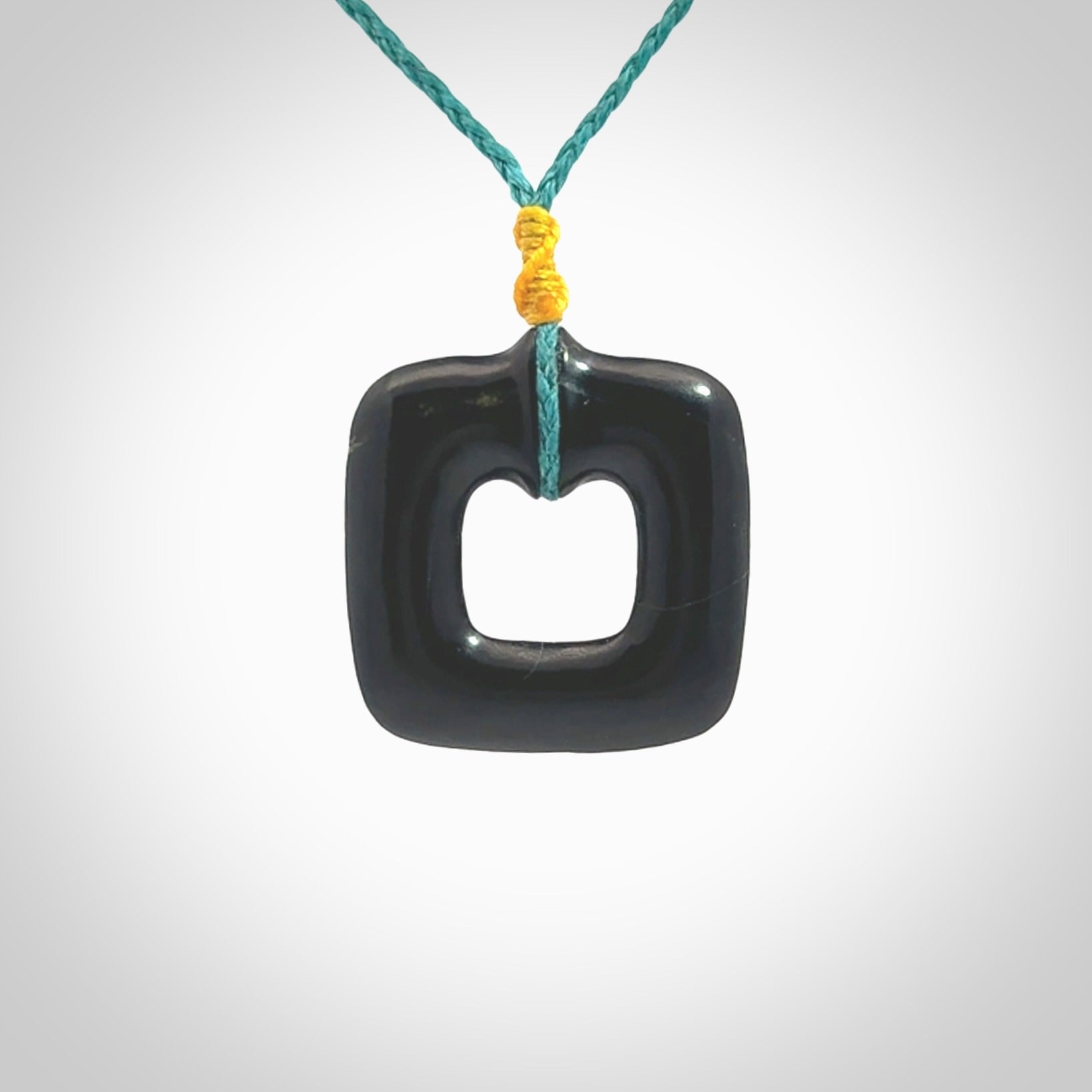 Contemporary pendant hand carved from Australian Black Jade. Designed and made by NZ Pacific. All hand carved in Black Jade and provided with adjustable cords.