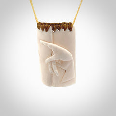 Hand carved large bone drop with hand carving. A stunning work of art. This pendant is hand carved in bone and provided with an adjustable cord. A one off work of art to wear by NZ Pacific.