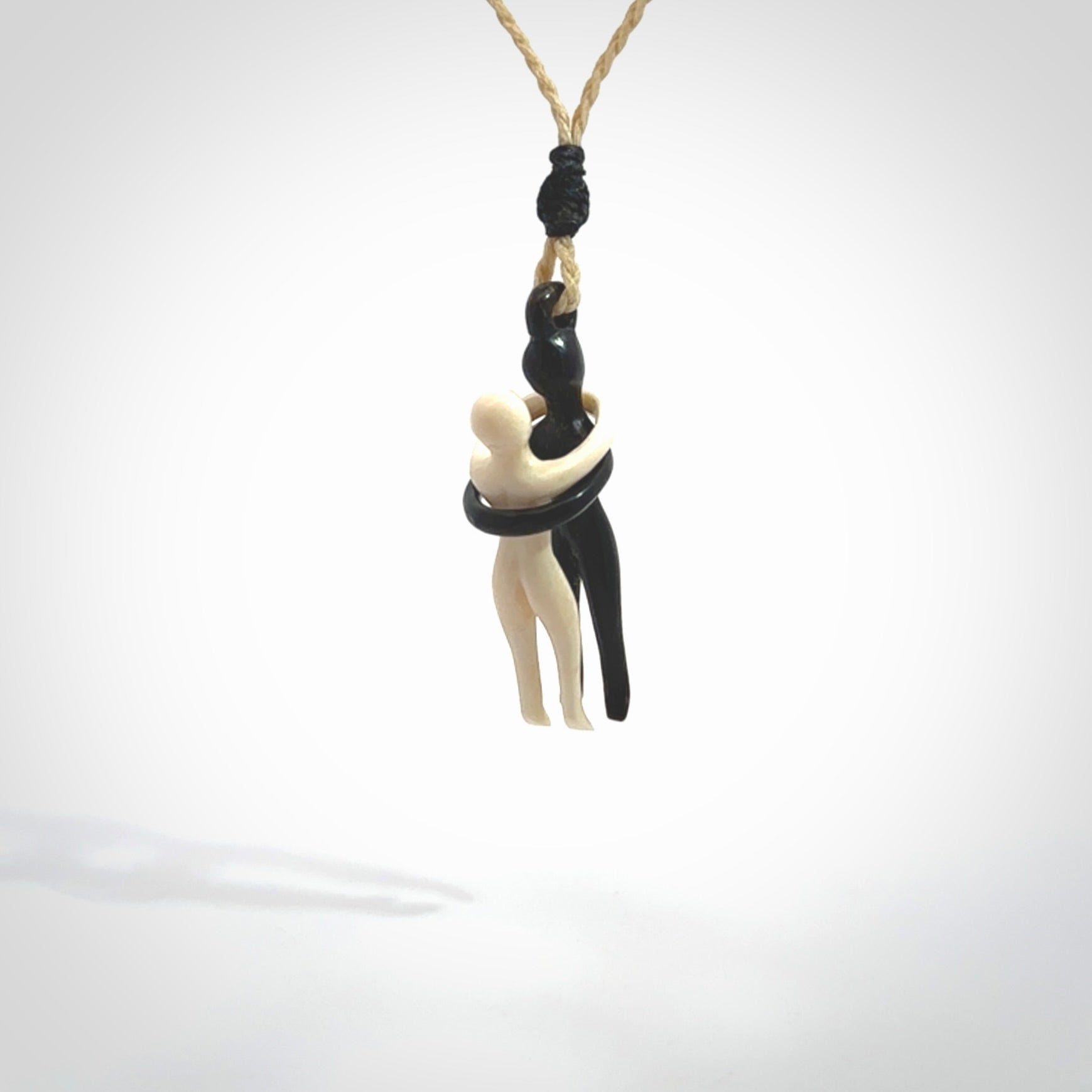 This small sized couples embrace pendant is made from Bone and Buffalo Horn. We've hand carved this piece for all the lovers out there. Free postage worldwide. Bone and Buffalo Horn couple hugging jewellery. Provided with an adjustable oat coloured cord and packaged in a woven kete pouch.