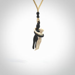 This small sized couples embrace pendant is made from Bone and Buffalo Horn. We've hand carved this piece for all the lovers out there. Free postage worldwide. Bone and Buffalo Horn couple hugging jewellery. Provided with an adjustable oat coloured cord and packaged in a woven kete pouch.