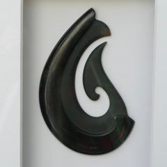 A hand carved large New Zealand Jade Hook necklace that has been framed and signed by artist Kerry Thompson. A large sized hand made Hei Matau necklace by New Zealand artist Kerry Thompson. One off framed work of art to wear. Delivered with Express Courier.