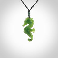 A hand carved seahorse pendant. We have carved this from beautiful nephrite jade and we bind them with our hand-plaited cords. the cords are a waxed polyester so they are durable and strong. We ship these worldwide with express courier anywhere in the world.