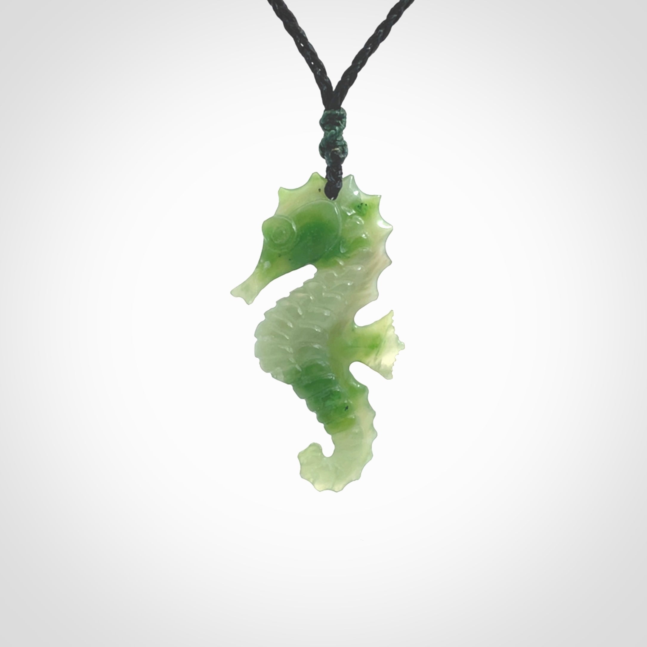 A hand carved seahorse pendant. We have carved this from beautiful nephrite jade and we bind them with our hand-plaited cords. the cords are a waxed polyester so they are durable and strong. We ship these worldwide with express courier anywhere in the world.