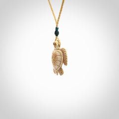 This is a beautiful hand carved woolly mammoth tusk turtle pendant. A really cool piece that is made from this rare and beautiful material. The mammoth has a very distinctive grain and each piece is different. We ship this worldwide and the cost of shipping is included in the price.