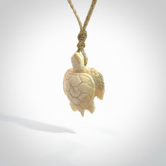 This is a beautiful hand carved woolly mammoth tusk turtle pendant. A really cool piece that is made from this rare and beautiful material. The mammoth has a very distinctive grain and each piece is different. We ship this worldwide and the cost of shipping is included in the price.