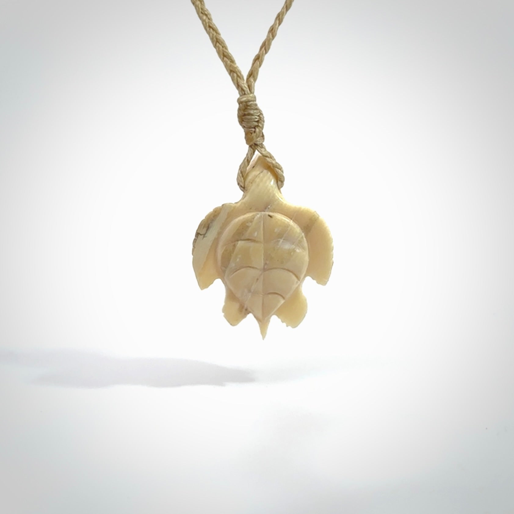 This is a beautiful hand carved woolly mammoth tusk turtle pendant. A really cool piece that is made from this rare and beautiful material. The mammoth has a very distinctive grain and each piece is different. We ship this worldwide and the cost of shipping is included in the price.