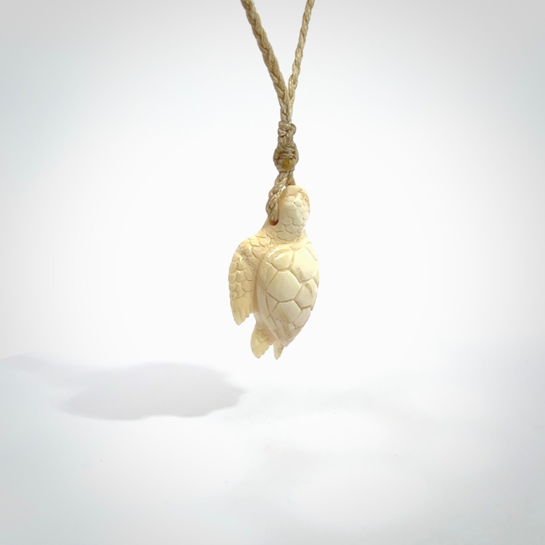 This is a beautiful hand carved woolly mammoth tusk turtle pendant. A really cool piece that is made from this rare and beautiful material. The mammoth has a very distinctive grain and each piece is different. We ship this worldwide and the cost of shipping is included in the price.