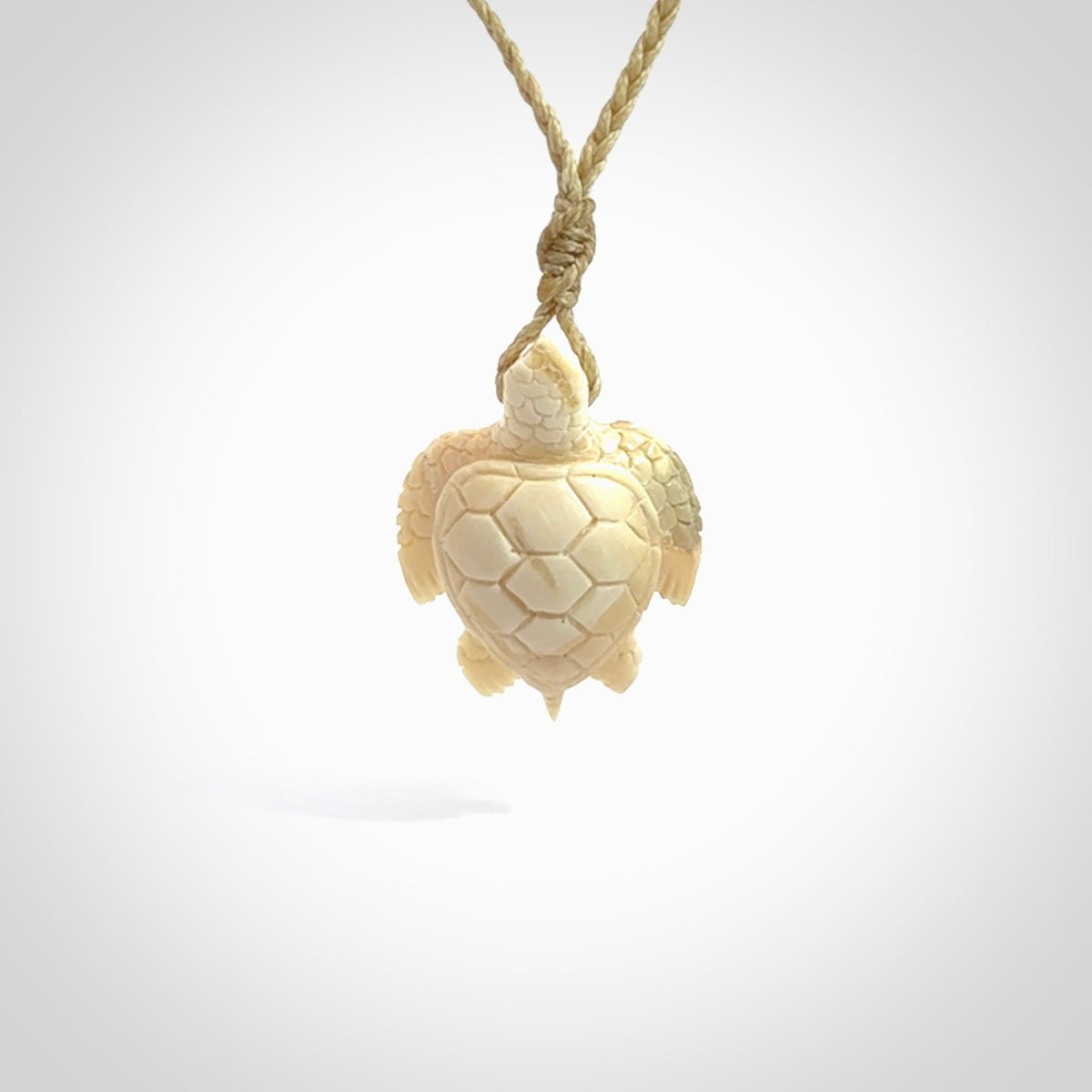 This is a beautiful hand carved woolly mammoth tusk turtle pendant. A really cool piece that is made from this rare and beautiful material. The mammoth has a very distinctive grain and each piece is different. We ship this worldwide and the cost of shipping is included in the price.