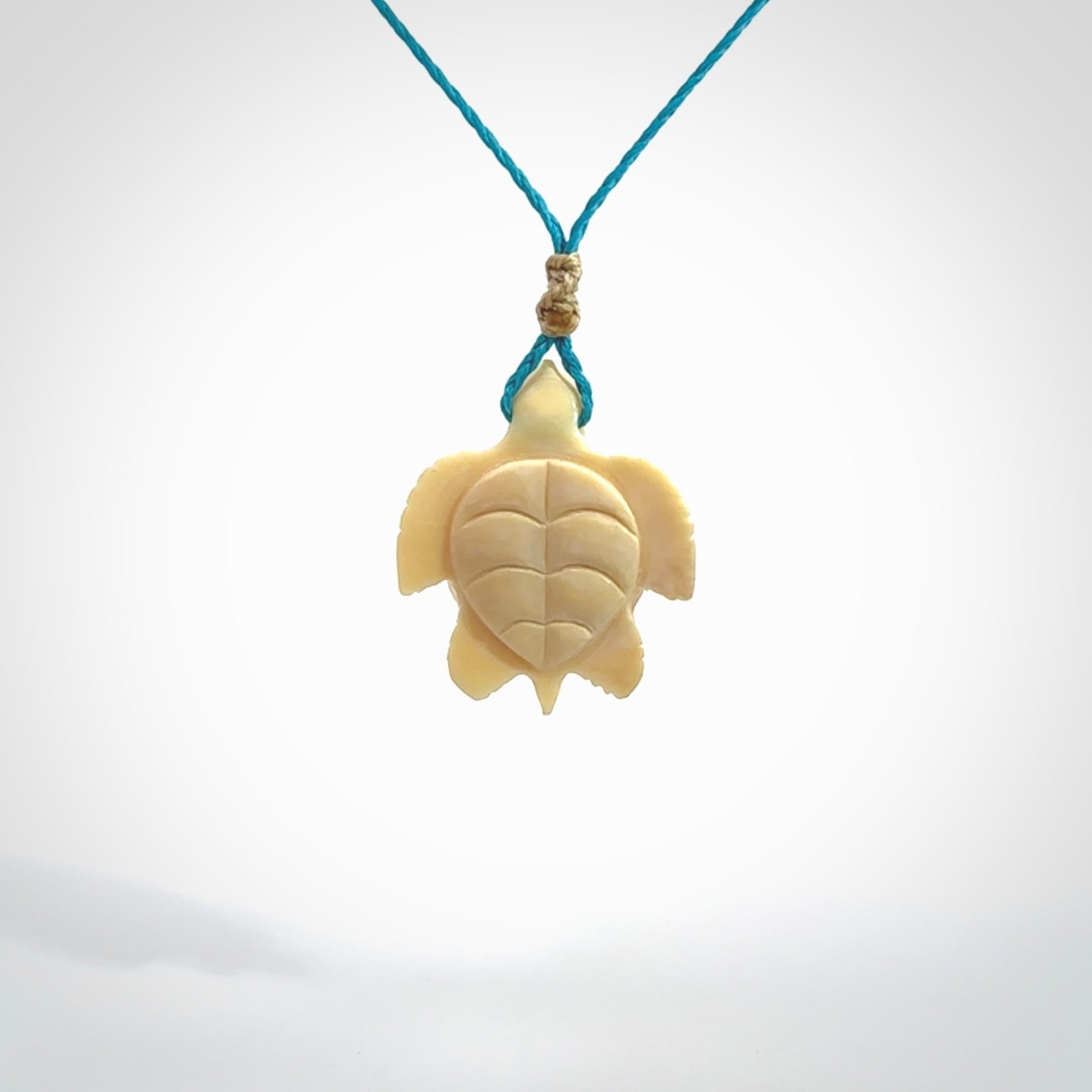 This is a beautiful hand carved woolly mammoth tusk turtle pendant. A really cool piece that is made from this rare and beautiful material. The mammoth has a very distinctive grain and each piece is different. We ship this worldwide and the cost of shipping is included in the price.