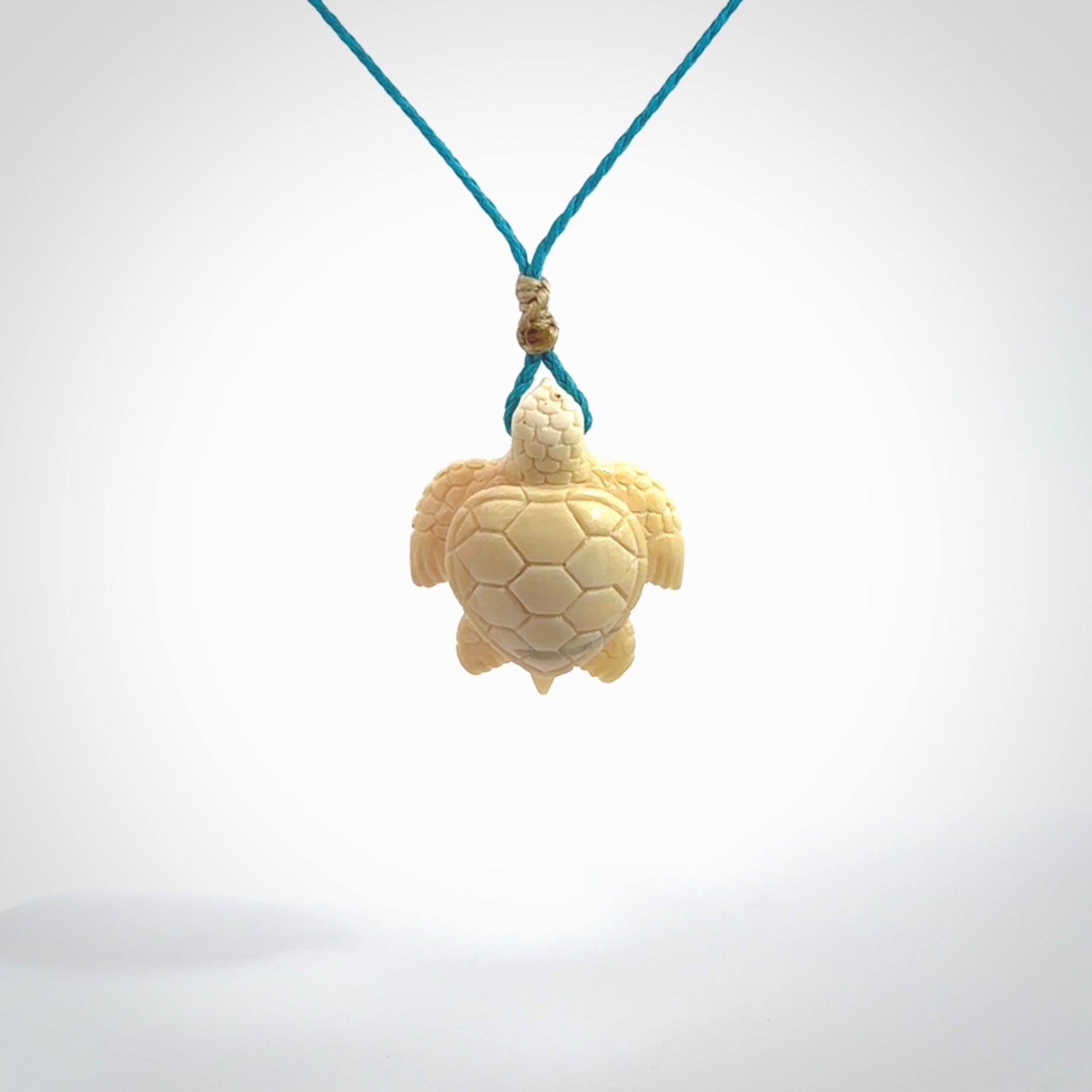 This is a beautiful hand carved woolly mammoth tusk turtle pendant. A really cool piece that is made from this rare and beautiful material. The mammoth has a very distinctive grain and each piece is different. We ship this worldwide and the cost of shipping is included in the price.