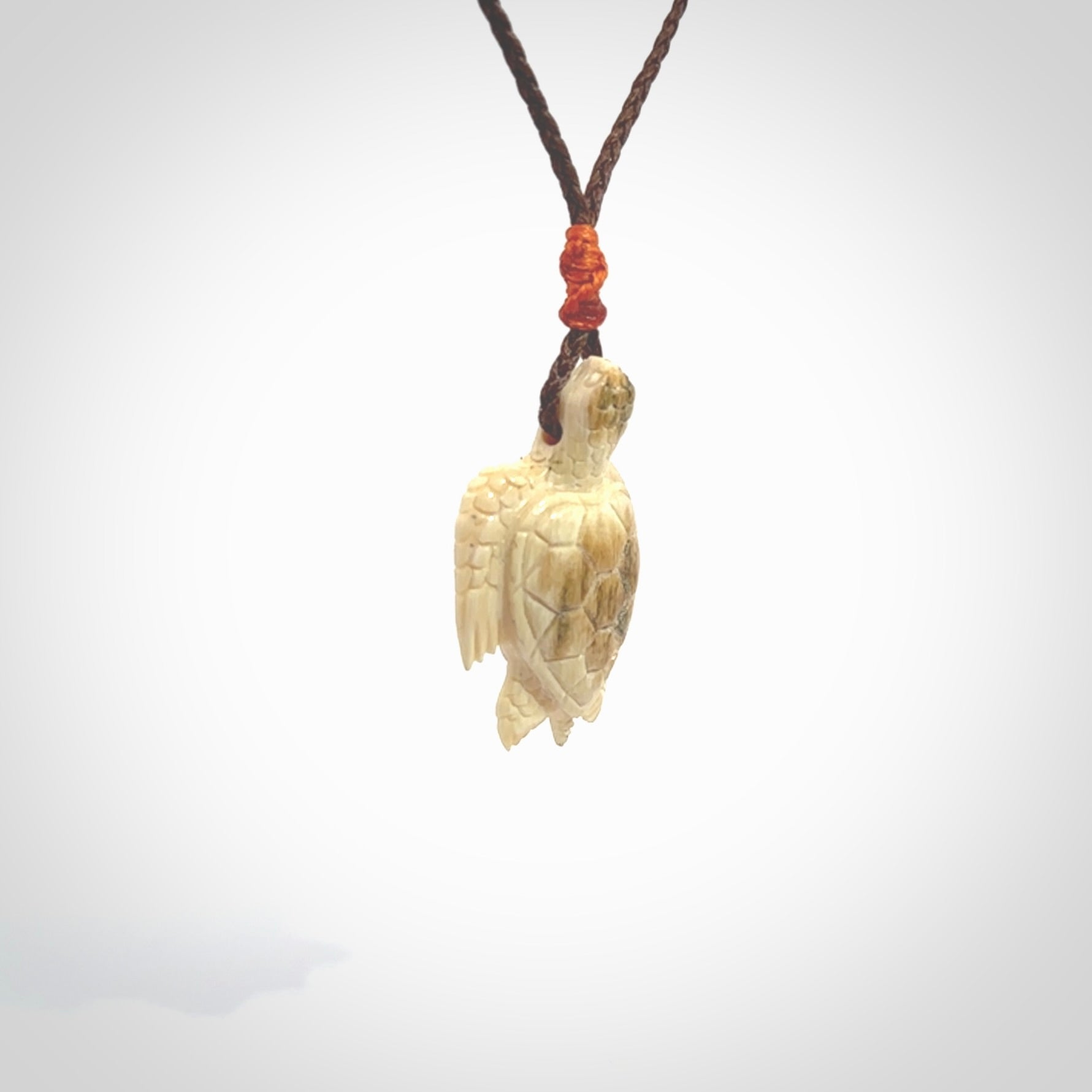 This is a beautiful hand carved woolly mammoth tusk turtle pendant. A really cool piece that is made from this rare and beautiful material. The mammoth has a very distinctive grain and each piece is different. We ship this worldwide and the cost of shipping is included in the price.