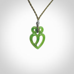 This is a handcarved love heart pendant made from a gorgeous and striking piece of British Columbia Jade stone. This is a superbly carved and very unique piece if custom jewellery. For sale online from NZ Pacific.