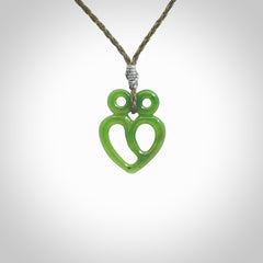 This is a handcarved love heart pendant made from a gorgeous and striking piece of British Columbia Jade stone. This is a superbly carved and very unique piece if custom jewellery. For sale online from NZ Pacific.