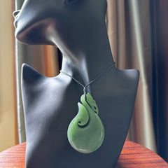 A New Zealand jade manaia necklace carved in lovely New Zealand Inanga jade. The pendant is suspended from a plaited cord. The cord is length adjustable so you can position the pendant where it suits you best. One only Ross Crump Manaia with hook pendant.