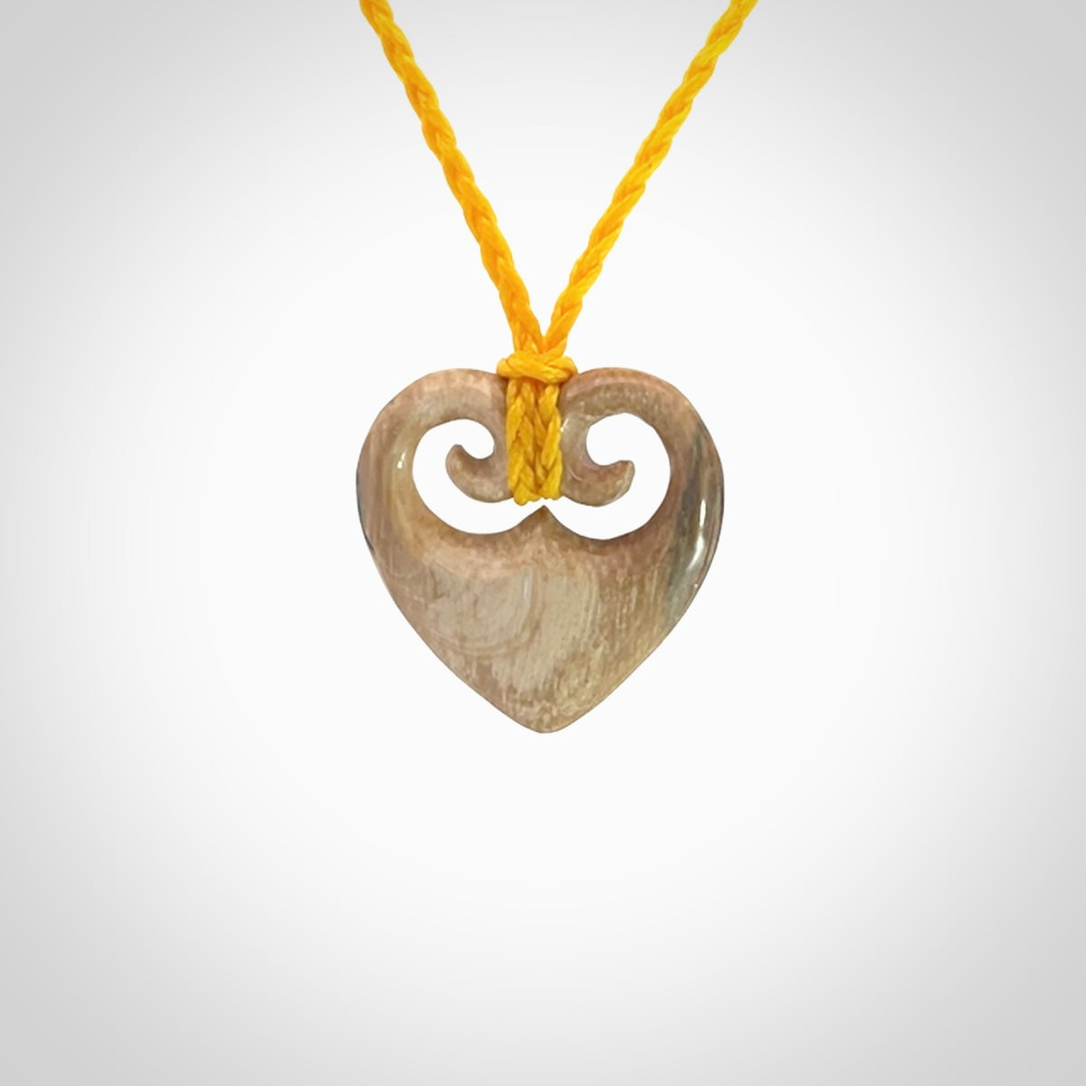 Hand carved heart pendant. Hand made from woolly mammoth tusk. Hand made jewellery for sale online. Rare and unique handmade jewellery. Made by NZ Pacific.