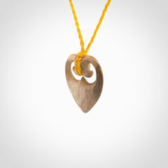 Hand carved heart pendant. Hand made from woolly mammoth tusk. Hand made jewellery for sale online. Rare and unique handmade jewellery. Made by NZ Pacific.