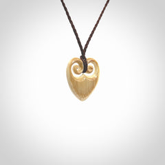 Hand carved heart pendant. Hand made from woolly mammoth tusk. Hand made jewellery for sale online. Rare and unique handmade jewellery. Made by NZ Pacific.