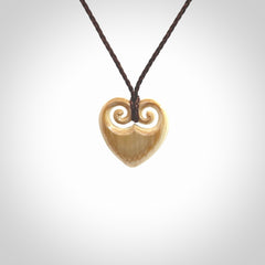 Hand carved heart pendant. Hand made from woolly mammoth tusk. Hand made jewellery for sale online. Rare and unique handmade jewellery. Made by NZ Pacific.