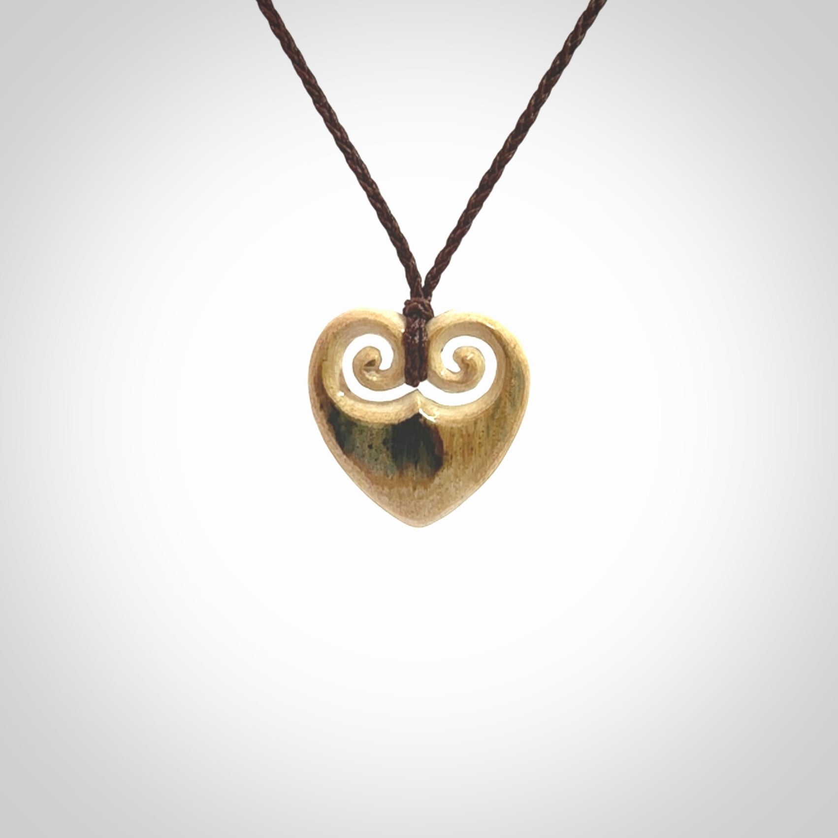 Hand carved heart pendant. Hand made from woolly mammoth tusk. Hand made jewellery for sale online. Rare and unique handmade jewellery. Made by NZ Pacific.