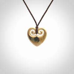 Hand carved heart pendant. Hand made from woolly mammoth tusk. Hand made jewellery for sale online. Rare and unique handmade jewellery. Made by NZ Pacific.