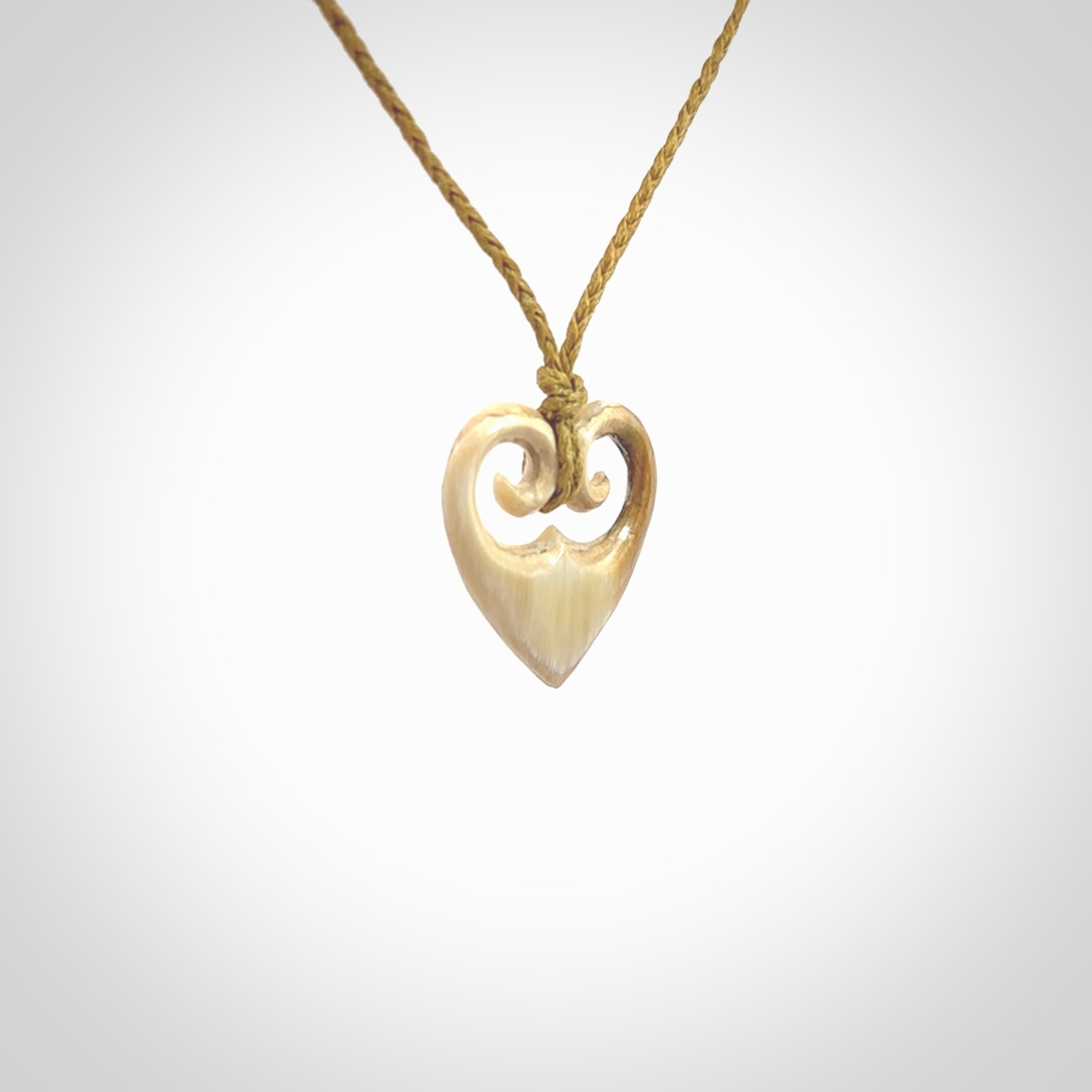 Hand carved heart pendant. Hand made from woolly mammoth tusk. Hand made jewellery for sale online. Rare and unique handmade jewellery. Made by NZ Pacific.