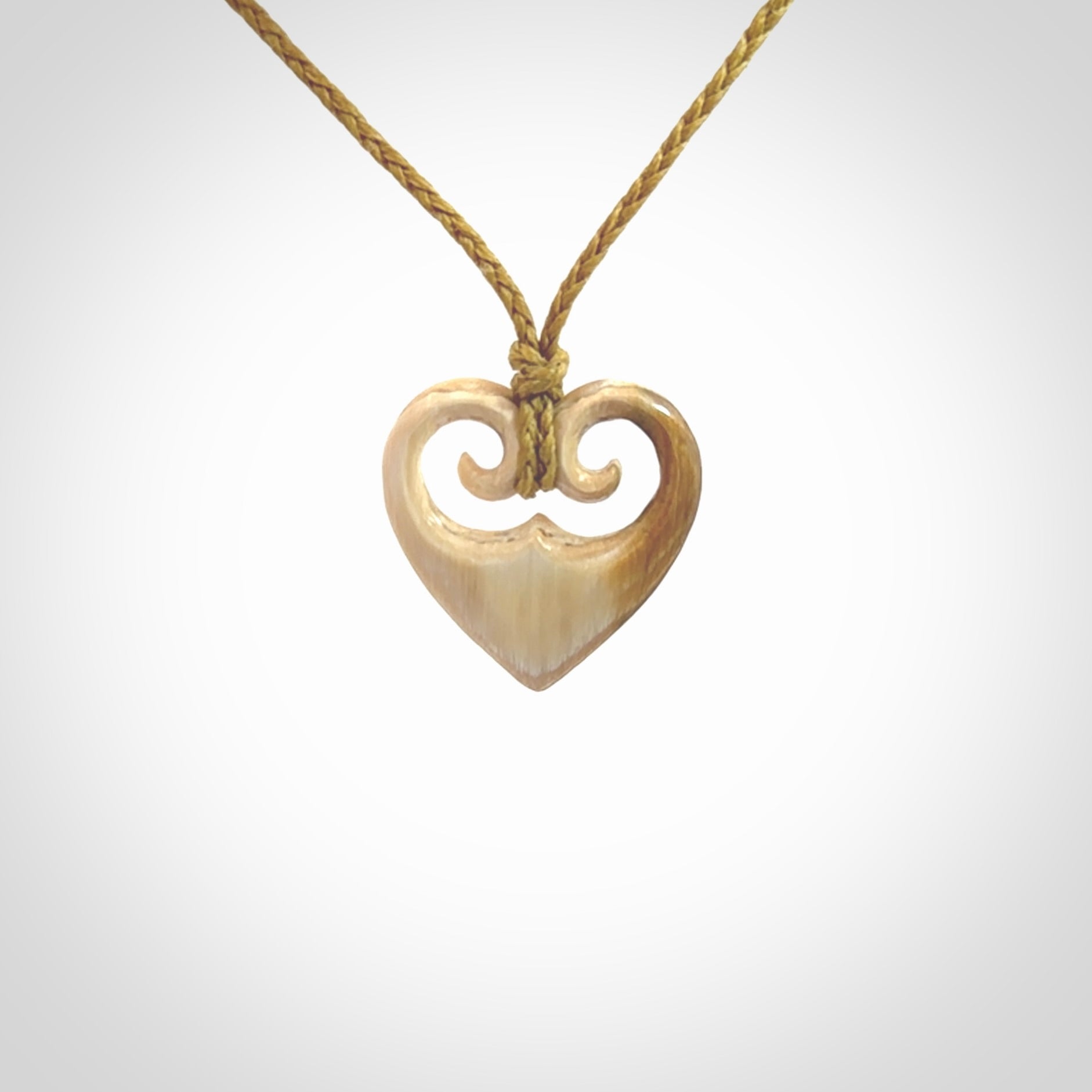 Hand carved heart pendant. Hand made from woolly mammoth tusk. Hand made jewellery for sale online. Rare and unique handmade jewellery. Made by NZ Pacific.