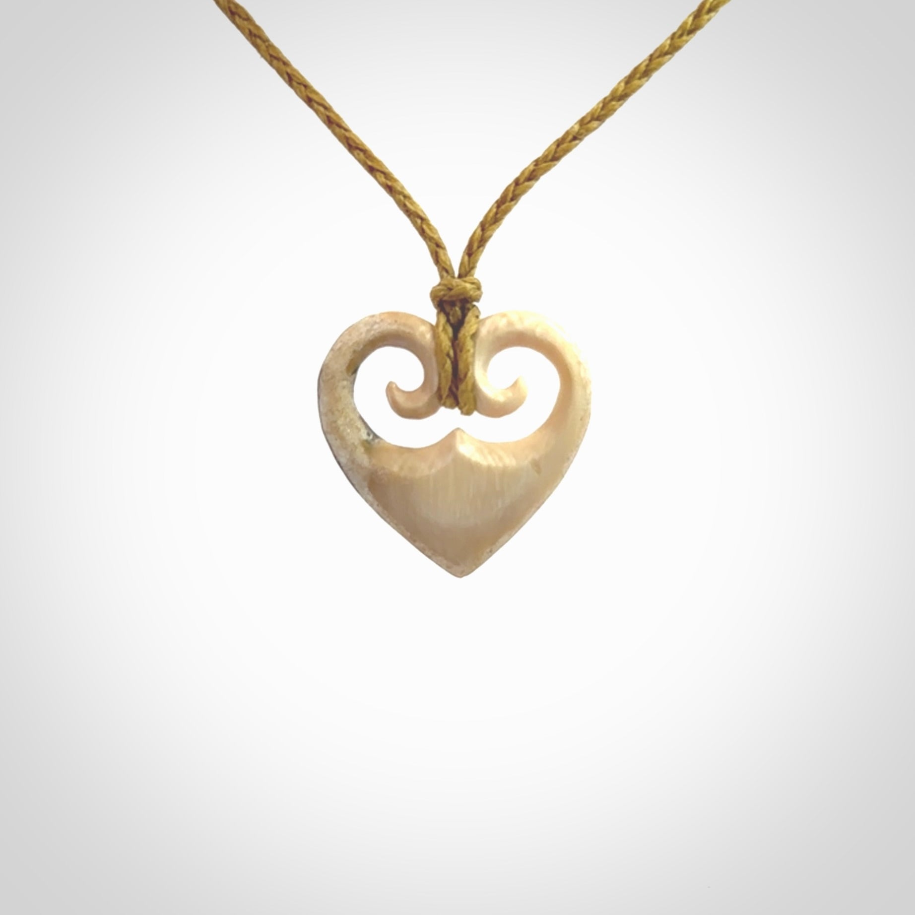 Hand carved heart pendant. Hand made from woolly mammoth tusk. Hand made jewellery for sale online. Rare and unique handmade jewellery. Made by NZ Pacific.