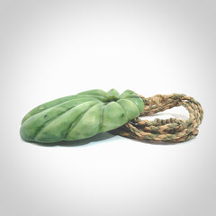 This picture shows a contemporary drop shaped pendant, hand carved from New Zealand flower jade. We will provide this with an adjustable plaited cord. Hand crafted stunning New Zealand Marsden Flower Jade drop pendant by Ana Krakosky.