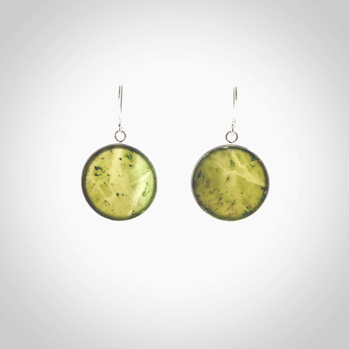 Hand carved medium Nephrite jade circle earrings. Made by NZ Pacific from real jade. Online jewellery for sale online by NZ Pacific.