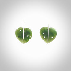 These are stunning heart shaped jade kawakawa leaf earrings carved in New Zealand by Josey Coyle. It is carved from a deep green piece of New Zealand Jade and with Sterling Silver hooks.