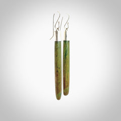 These are stunning large sized drop flower jade earrings carved in New Zealand by Josey Coyle. It is carved from a beautiful green piece of New Zealand Flower Jade and with Sterling Silver hooks and findings.