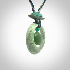 Hand carved New Zealand Jade peace bell pendant with adjustable cord. This piece is a stand out work of creativity and skill and we love Jen Hung's creations. Unique, one only, New Zealand made necklace for sale. Free shipping worldwide.