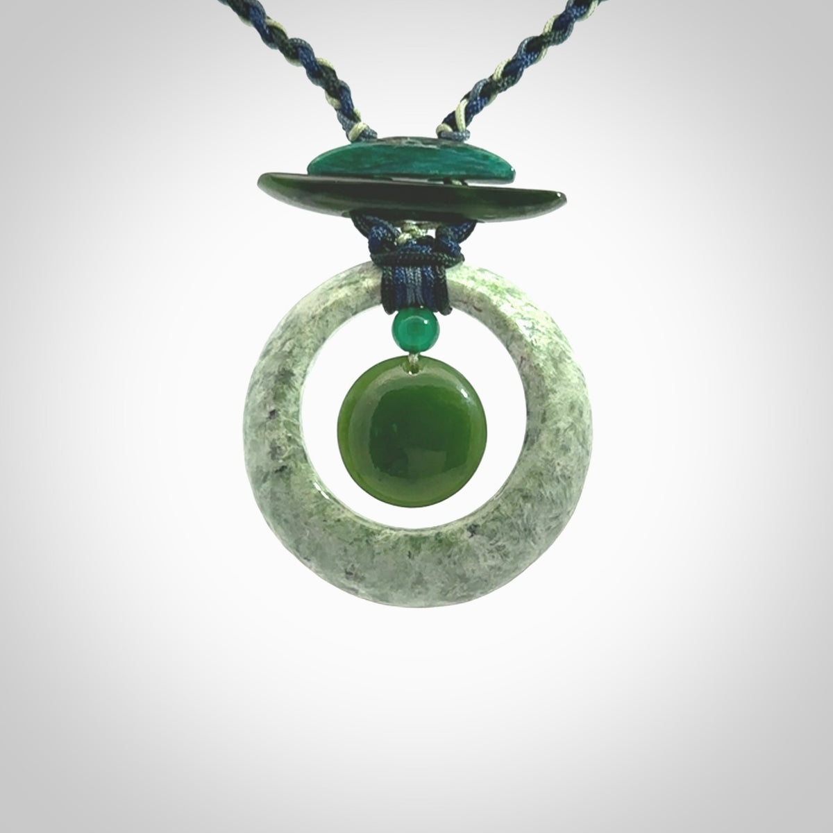 Hand carved New Zealand Jade peace bell pendant with adjustable cord. This piece is a stand out work of creativity and skill and we love Jen Hung's creations. Unique, one only, New Zealand made necklace for sale. Free shipping worldwide.