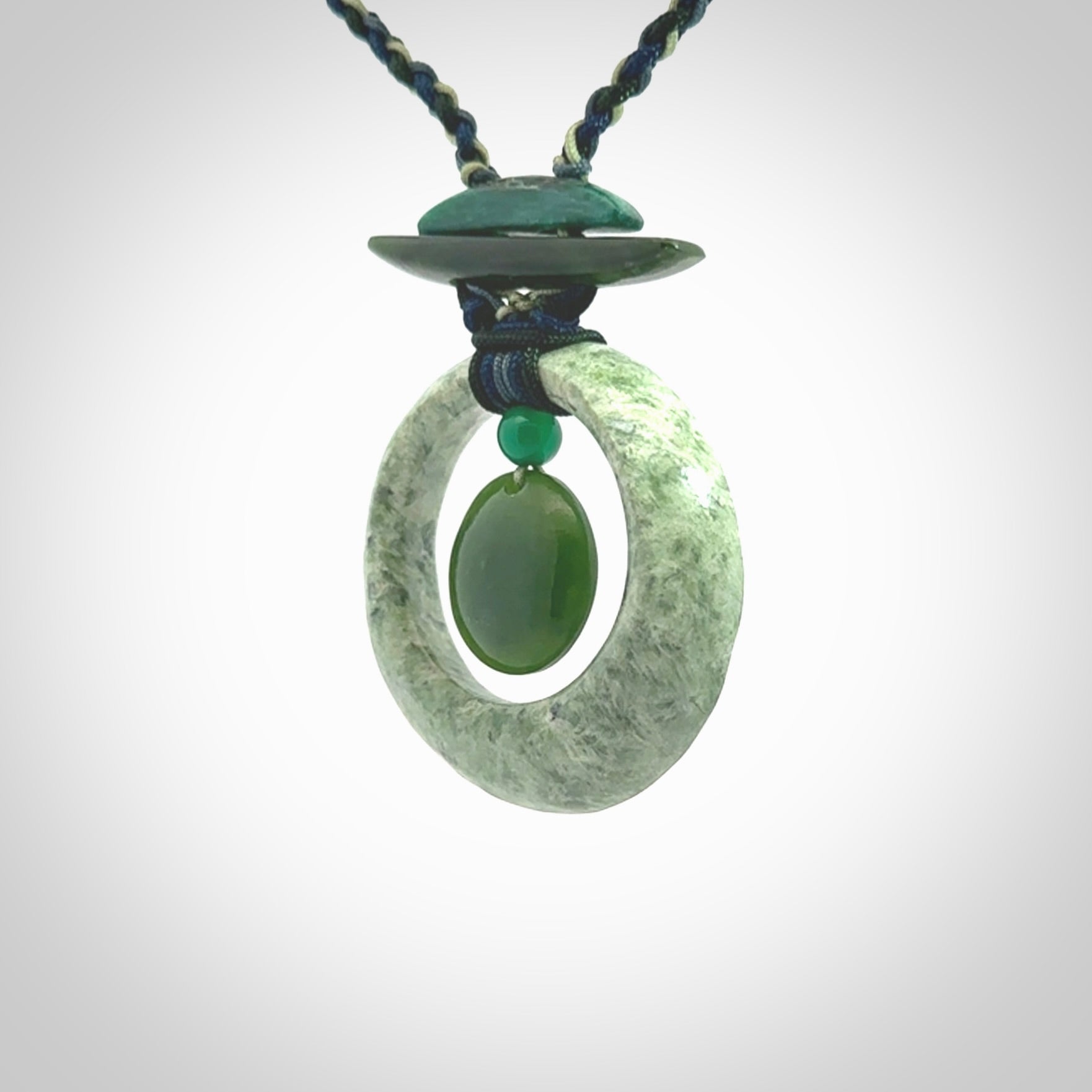 Hand carved New Zealand Jade peace bell pendant with adjustable cord. This piece is a stand out work of creativity and skill and we love Jen Hung's creations. Unique, one only, New Zealand made necklace for sale. Free shipping worldwide.