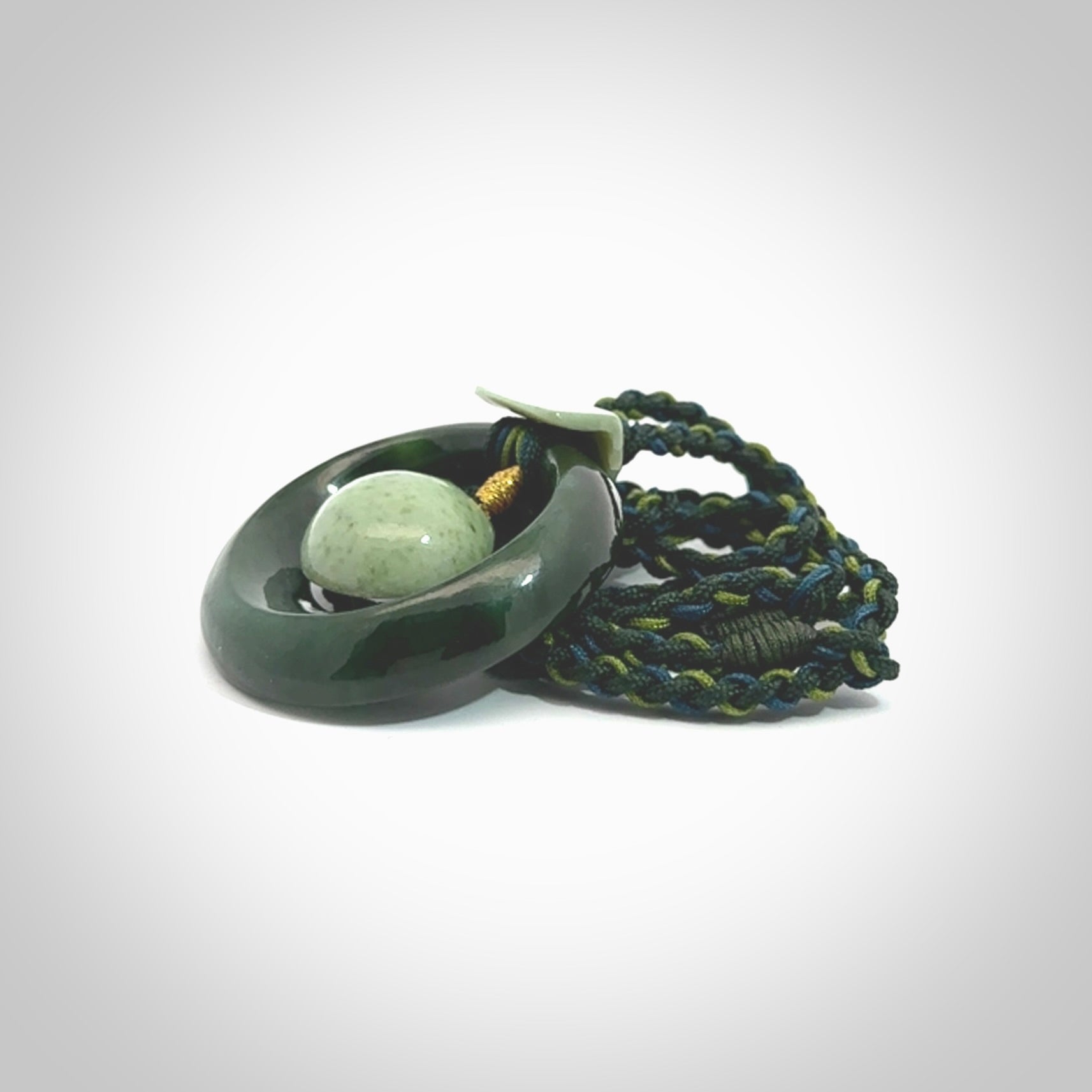 Hand carved New Zealand Jade peace bell pendant with adjustable cord. This piece is a stand out work of creativity and skill and we love Jen Hung's creations. Unique, one only, New Zealand made necklace for sale. Free shipping worldwide.