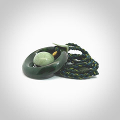 Hand carved New Zealand Jade peace bell pendant with adjustable cord. This piece is a stand out work of creativity and skill and we love Jen Hung's creations. Unique, one only, New Zealand made necklace for sale. Free shipping worldwide.