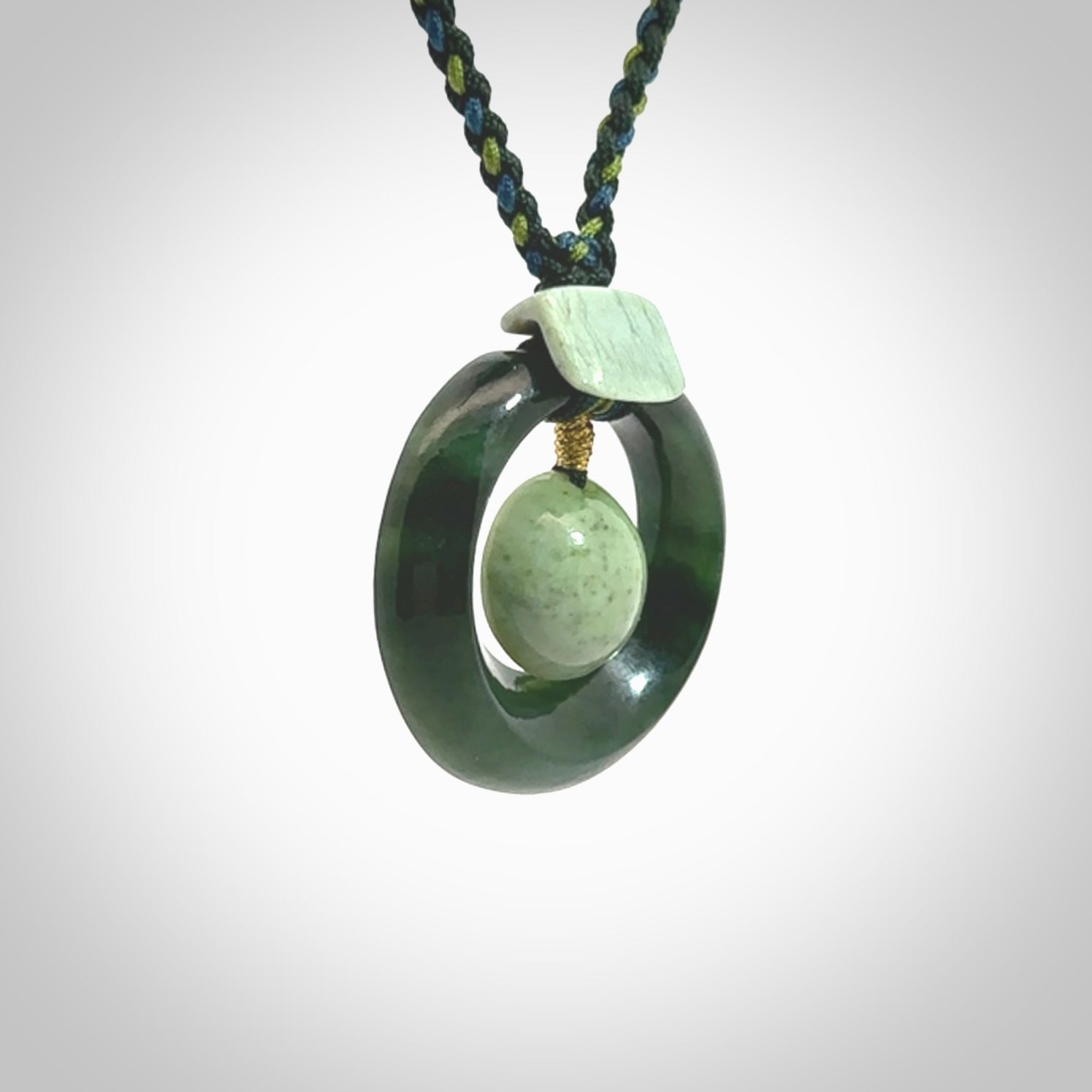 Hand carved New Zealand Jade peace bell pendant with adjustable cord. This piece is a stand out work of creativity and skill and we love Jen Hung's creations. Unique, one only, New Zealand made necklace for sale. Free shipping worldwide.