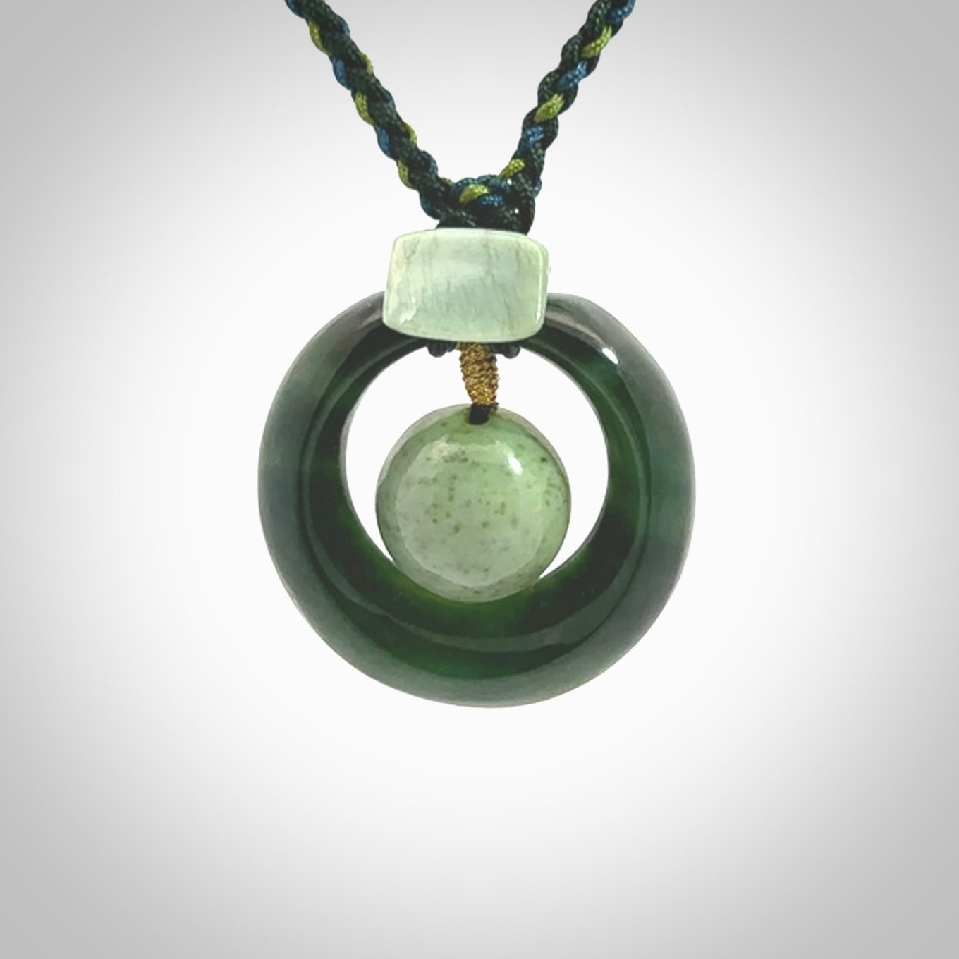 Hand carved New Zealand Jade peace bell pendant with adjustable cord. This piece is a stand out work of creativity and skill and we love Jen Hung's creations. Unique, one only, New Zealand made necklace for sale. Free shipping worldwide.