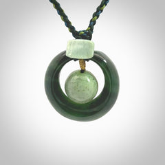 Hand carved New Zealand Jade peace bell pendant with adjustable cord. This piece is a stand out work of creativity and skill and we love Jen Hung's creations. Unique, one only, New Zealand made necklace for sale. Free shipping worldwide.