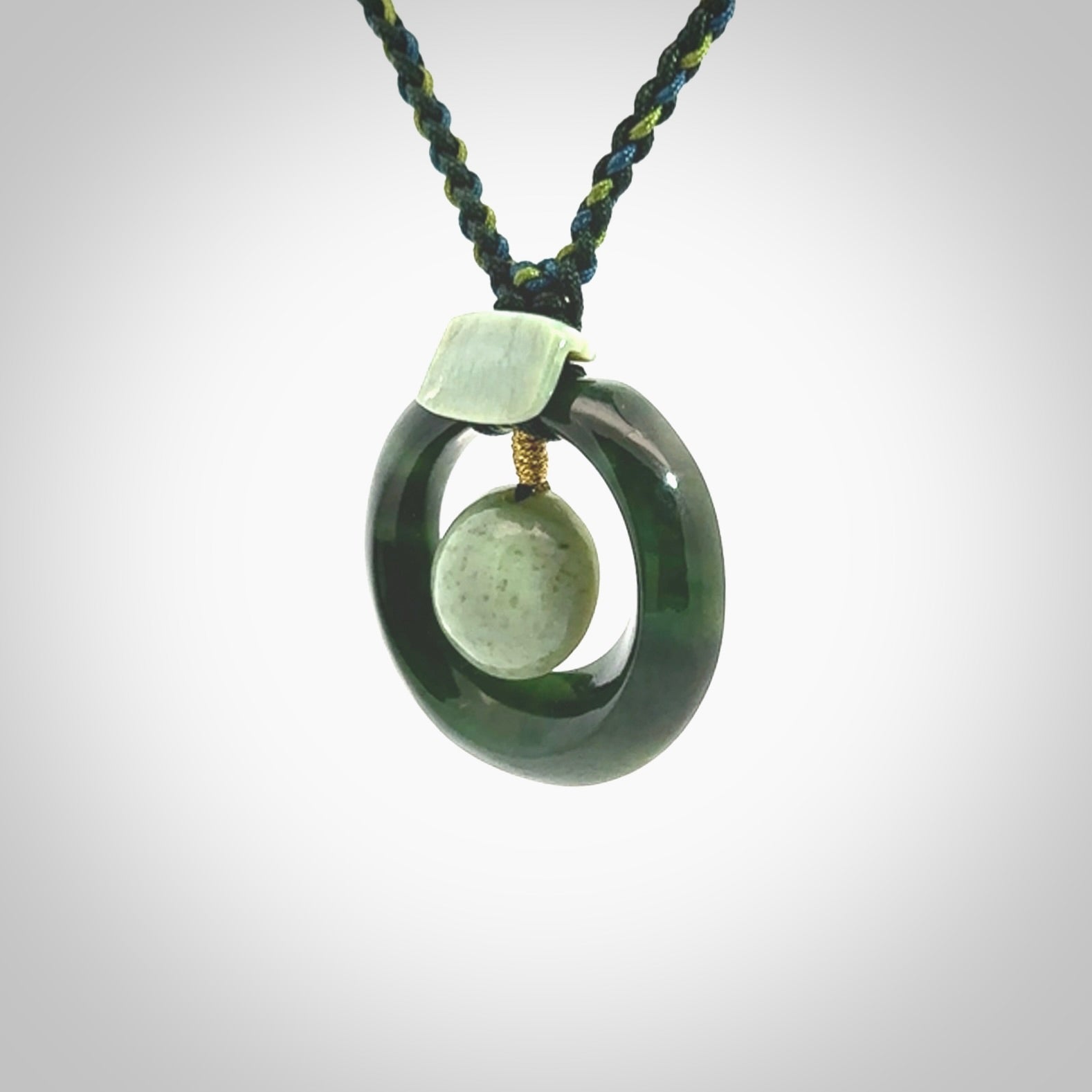 Hand carved New Zealand Jade peace bell pendant with adjustable cord. This piece is a stand out work of creativity and skill and we love Jen Hung's creations. Unique, one only, New Zealand made necklace for sale. Free shipping worldwide.