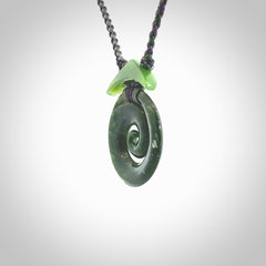 Hand carved New Zealand Jade Koru pendant with adjustable cord. This piece is a stand out work of creativity and skill and we love Jen Hung's creations. Unique, one only, New Zealand made necklace for sale. Free shipping worldwide.