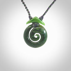 Hand carved New Zealand Jade Koru pendant with adjustable cord. This piece is a stand out work of creativity and skill and we love Jen Hung's creations. Unique, one only, New Zealand made necklace for sale. Free shipping worldwide.