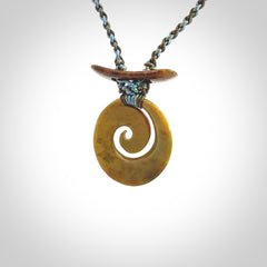 Hand carved New Zealand Flower Jade Koru pendant with adjustable cord. This piece is a stand out work of creativity and skill and we love Jen Hung's creations. Unique, one only, New Zealand made necklace for sale. Free shipping worldwide.