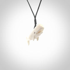 Hand carved bone contemporary sperm whale pendant. Hand carved by NZ Pacific. Free postage worldwide. Hand made whale necklace from bone. Ocean themed necklace for men and women.