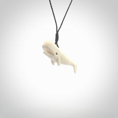 Hand carved bone contemporary sperm whale pendant. Hand carved by NZ Pacific. Free postage worldwide. Hand made whale necklace from bone. Ocean themed necklace for men and women.