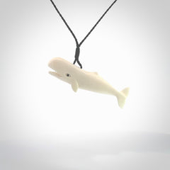 Hand carved bone contemporary sperm whale pendant. Hand carved by NZ Pacific. Free postage worldwide. Hand made whale necklace from bone. Ocean themed necklace for men and women.