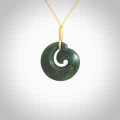 This picture shows a koru pendant, hand carved from New Zealand jade. We will provide this with an adjustable plaited cord. This has been hand carved by Kyohei Noguchi. One only pendant, shipped to you with express courier.