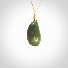 This pendant is a medium sized leaf drop design with koru heart necklace carved from a gorgeous piece of New Zealand Jade. Kyohei Noguchi carved this piece for us so the workmanship is outstanding. Handmade in New Zealand, a beautiful piece of jade jewellery.